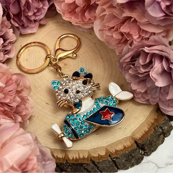 Hello Kitty Flying a Bkue Crystal Airplane Keychain Charm - Picture 9 of 16